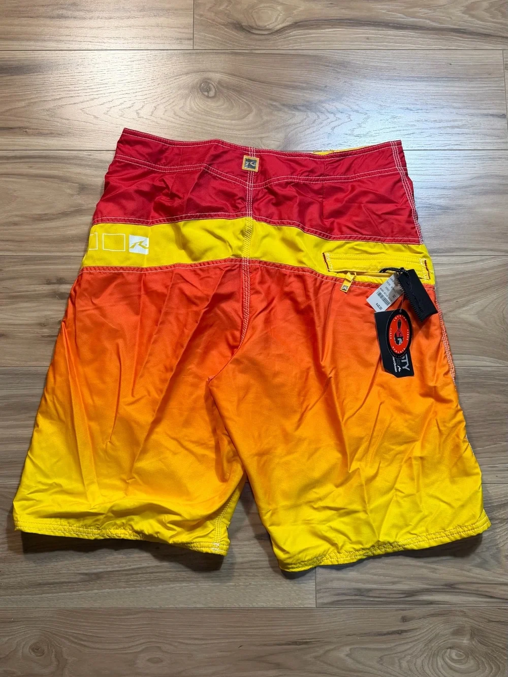 Brand new with tags Rusty Men’s Gradient Red-Orange-Yellow Swim Trunks
